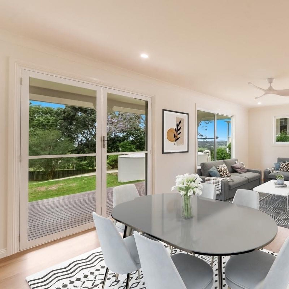 Interior repaint of an open-plan dining and living room with white walls and trim by R J Britt Painting in Lismore, NSW