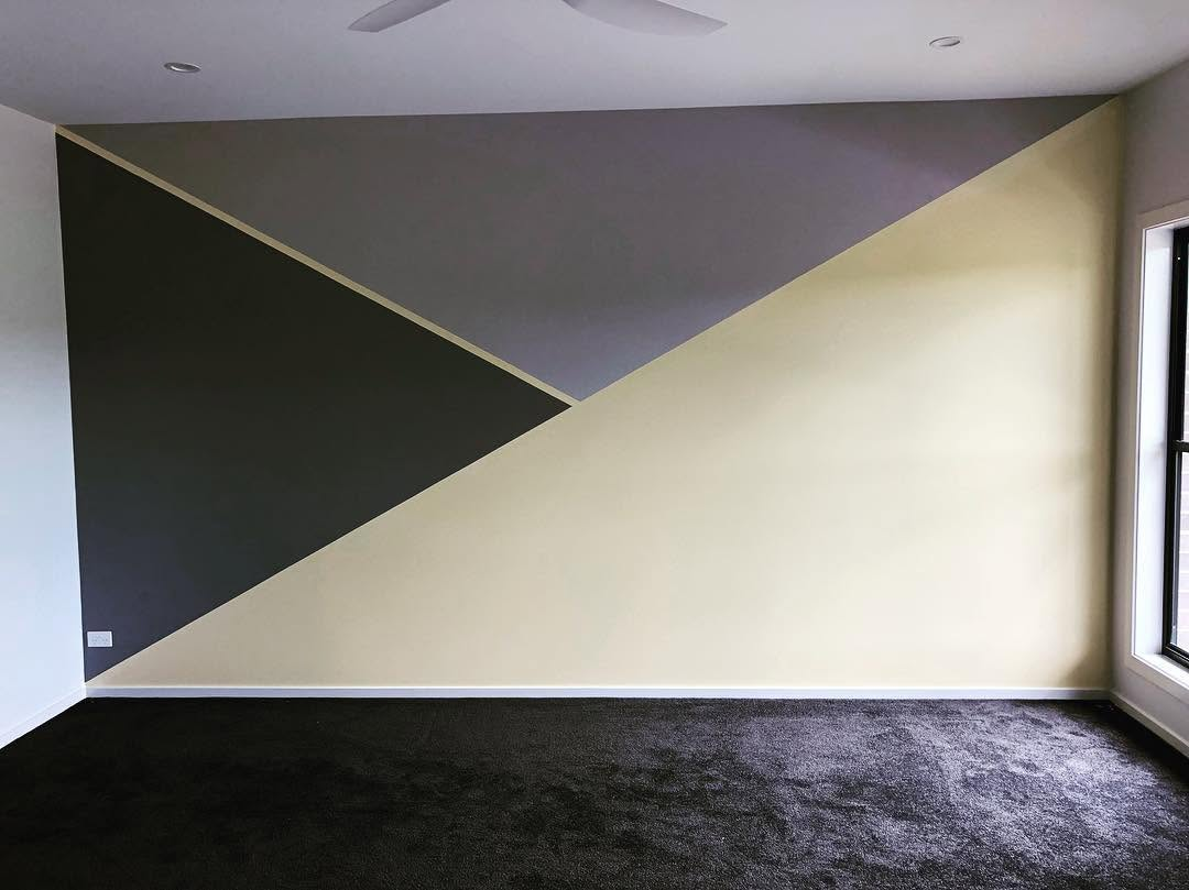 Interior feature wall painted in geometric charcoal, grey and cream panels by R J Britt Painting in Lismore, NSW