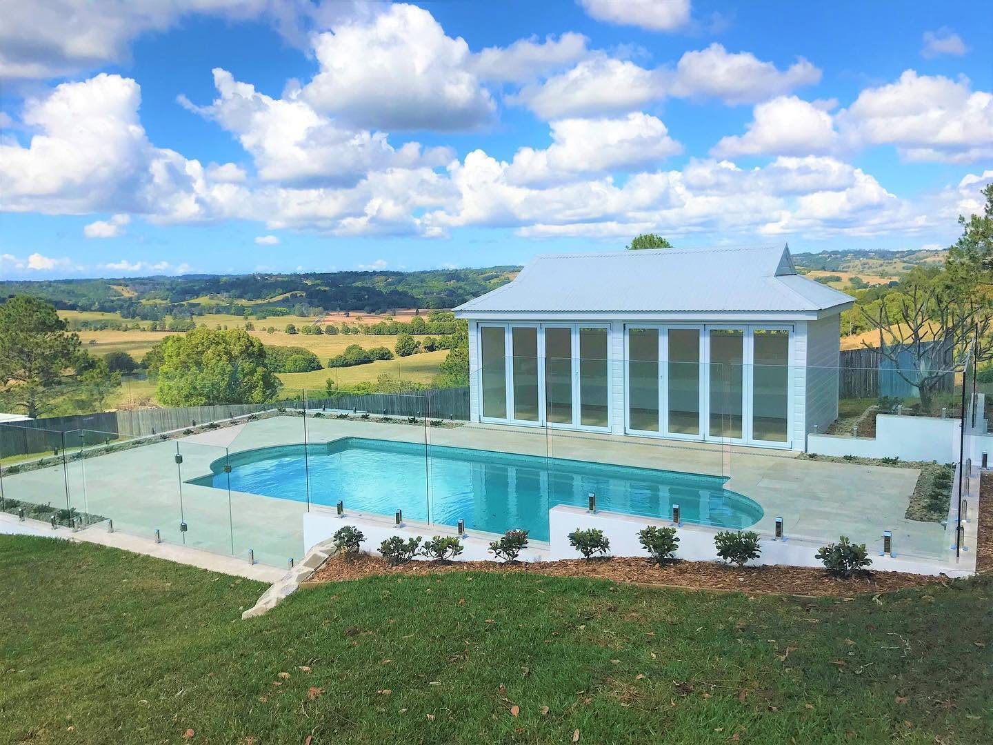 Freshly painted white poolside pavilion with hinterland views, exterior painting by R J Britt Painting in Lismore, NSW