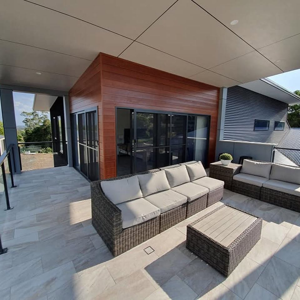 Undercover alfresco terrace with timber cladding and outdoor lounge setting painted by R J Britt Painting on the Gold Coast