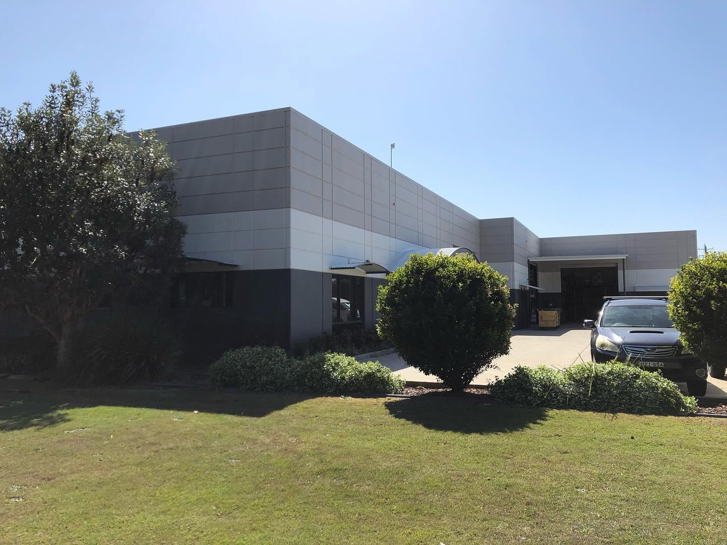 Repainted grey and charcoal commercial building exterior by R J Britt Painting, painters in Byron Bay