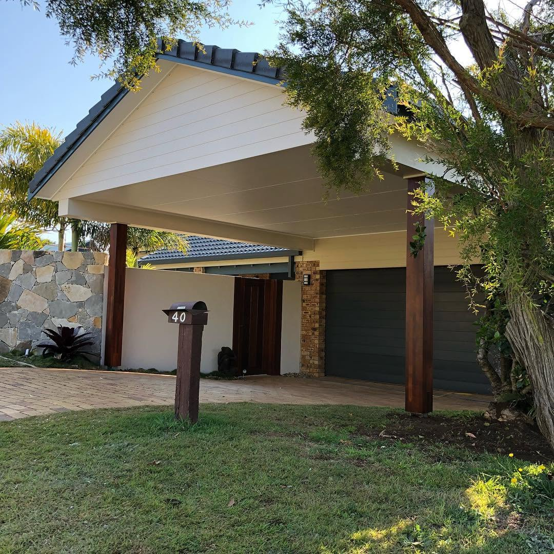 Freshly painted home entry with cream gable, dark trim and timber posts painted by R J Britt Painting in Ballina