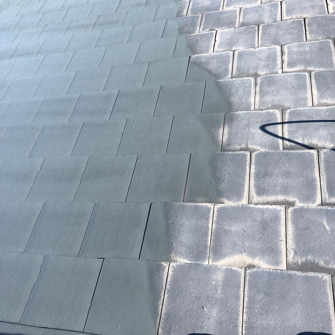 Exterior repaint showing freshly coated concrete roof tiles by R J Britt Painting in Lismore, NSW